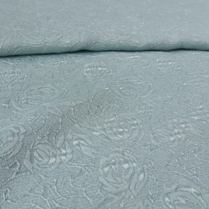 Tkanina żakardowa ze wzorem wytłaczanym, nadaje się na gorsety, górę sukienki, topy i inne - skład: mieszanka poliestru i wiskozy - szerokość: 110 cm  - kolor miętowy - cena za kupon 3 mb x 110 cm