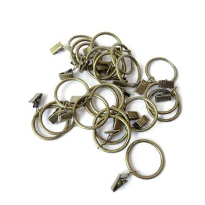 Żabka metalowa z plastikowym kółkiem w kolorze mosiężnym do zapinania firanek, zasłonek w dwóch rozmiarach: - średnica 35 mm  - średnica 25 mm