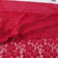 Delikatna tkanina koronkowa w kolorze ciemno czerwonym z mieniącymi się cekinami w kolorze tkaniny- lekko elastyczna- szerokość 140 cm