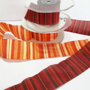 Wstążka z tkaniny w paski, do celów zdobniczych, brzegi usztywnione. - szerokość wstążki 37 mm, - kolory :  pomarańczowy